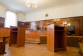 Empty courtroom with wooden benches