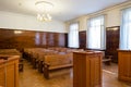 Empty courtroom with wooden benches