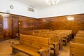 Empty courtroom with wooden benches
