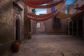 Empty courtyard in an old medieval Moroccan town with an archway leading to steps on the far side. 3D illustration Royalty Free Stock Photo