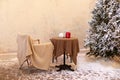 Festive snow winter street with outdoor cafe or coffe house. House veranda decorated outside, courtyard. Royalty Free Stock Photo