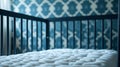 Empty crib with blue patterned wall background Royalty Free Stock Photo