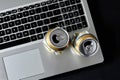 Empty crushed cans of beer on a laptop keyboard on a black background. Drunken conflicts in social networks