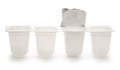 Empty crushed plastic yogurt pots
