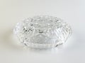 Empty crystal ashtray on a white background. Ashtray from the times of the USSR. Upside down Royalty Free Stock Photo
