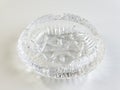 Empty crystal ashtray on a white background. The ashtray was made in the mid-20th century Royalty Free Stock Photo