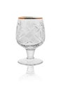 An empty crystal glass for whisky and brandy. Isolated on a white background with reflection Royalty Free Stock Photo