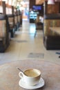 Empty cup of capuccino at cafe Royalty Free Stock Photo