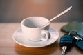 Empty Cup of hot coffee, Key and smartphone in cafe Royalty Free Stock Photo