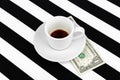Empty cup with one dollar as a tip on a black and white background. Royalty Free Stock Photo