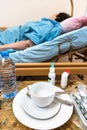 Empty cup and patient in homecare hospital bed