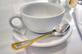 An empty cup and spoon. Tea party in the cafe. Royalty Free Stock Photo