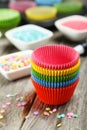 Empty cupcake cases on the colorful background Royalty Free Stock Photo