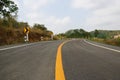 Empty curve road in the country and have forest on the street. Traffic sign warning curve Royalty Free Stock Photo