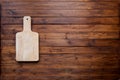 Empty cutting board on vintage dark wooden board food background concept Royalty Free Stock Photo