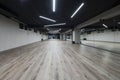 An empty dance hall with a glass wall adorned with decorative graffiti, offering a fusion of contemporary, urban Royalty Free Stock Photo