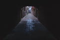 Dark alley behind arch in Venice, Italy Royalty Free Stock Photo