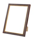 Empty dark brown wooden photo frame with golden border on stand isolated on white background Royalty Free Stock Photo