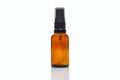 Empty dark glass spray bottle. Perfumes and essential oils. Close-up. Isolated on a white background. Space for text Royalty Free Stock Photo