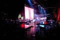 Empty Dark and Moody Night Club room with chairs and tables