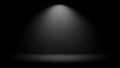 Dark stage with a single bright spotlight illuminating the floor and wall beam Royalty Free Stock Photo