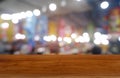 Empty dark wooden table in front of abstract blurred background of cafe and coffee shop interior. can be used for display or Royalty Free Stock Photo