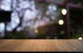 Empty dark wooden table in front of abstract blurred bokeh background of restaurant . can be used for display or montage your Royalty Free Stock Photo