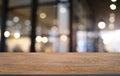 Empty dark wooden table in front of abstract blurred bokeh background of restaurant . can be used for display or montage your Royalty Free Stock Photo