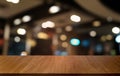 Empty dark wooden table in front of abstract blurred bokeh background of restaurant . can be used for display or montage your Royalty Free Stock Photo