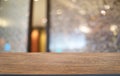 Empty dark wooden table in front of abstract blurred bokeh background of restaurant . can be used for display or montage your Royalty Free Stock Photo