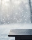 Empty dark wooden table and snow blurred background Royalty Free Stock Photo