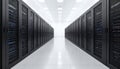 Empty data center hallway with rows of black server racks. Perspective creates sense of depth, leading towards bright white Royalty Free Stock Photo