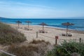 Empty deck chairs on the beach of Formentera beach during the afternoon siesta