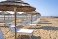 Empty deck chairs on coastal beach Royalty Free Stock Photo