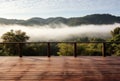 Empty deck overlooking fogcovered countryside