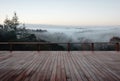 Empty deck overlooking fogcovered countryside