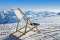 Empty deckchair on the side of a ski slope Royalty Free Stock Photo