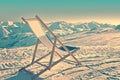 Empty deckchair on the side of a ski slope, vintage Royalty Free Stock Photo