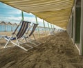 Empty deckchairs on beach