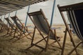 Empty deckchairs on beach