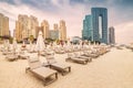 deckchairs with umbrellas and sunbeds at the JBR beach in Dubai. Travel and vacation destinations in United Arab Emirates