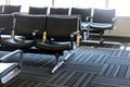 Empty airport departure lounge terminal waiting area with chairs Royalty Free Stock Photo