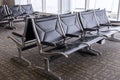 Empty airport departure lounge terminal waiting area with chairs Royalty Free Stock Photo