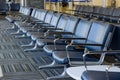 Empty airport departure lounge terminal waiting area with chairs Royalty Free Stock Photo