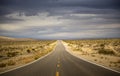 Empty Desert Road With Stormy Sky