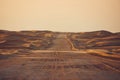 Empty desert road in the middle sand dunes Royalty Free Stock Photo