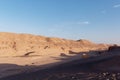 Desert under clear blue sky, serene landscape with sand dunes and no people Royalty Free Stock Photo