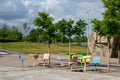 Empty and deserted, colorful chairs and tables outdoors in a park, playground. Royalty Free Stock Photo