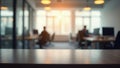 Empty desk in blurred modern open space office with programmers working Royalty Free Stock Photo