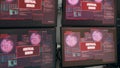 Empty desk with multiple monitors showing system crash warning Royalty Free Stock Photo